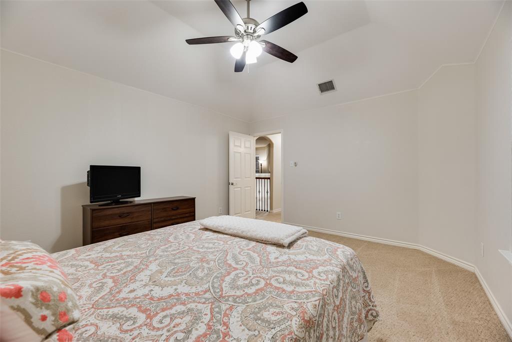 11920 Vienna Apple Road Fort Worth, TX 76244 - Photo 27 of 40 Upstairs oversized bedroom with carpet, ceiling fan and walk-in closet at 11920 Vienna Apple in Villages of Woodland Springs community in North Fort Worth