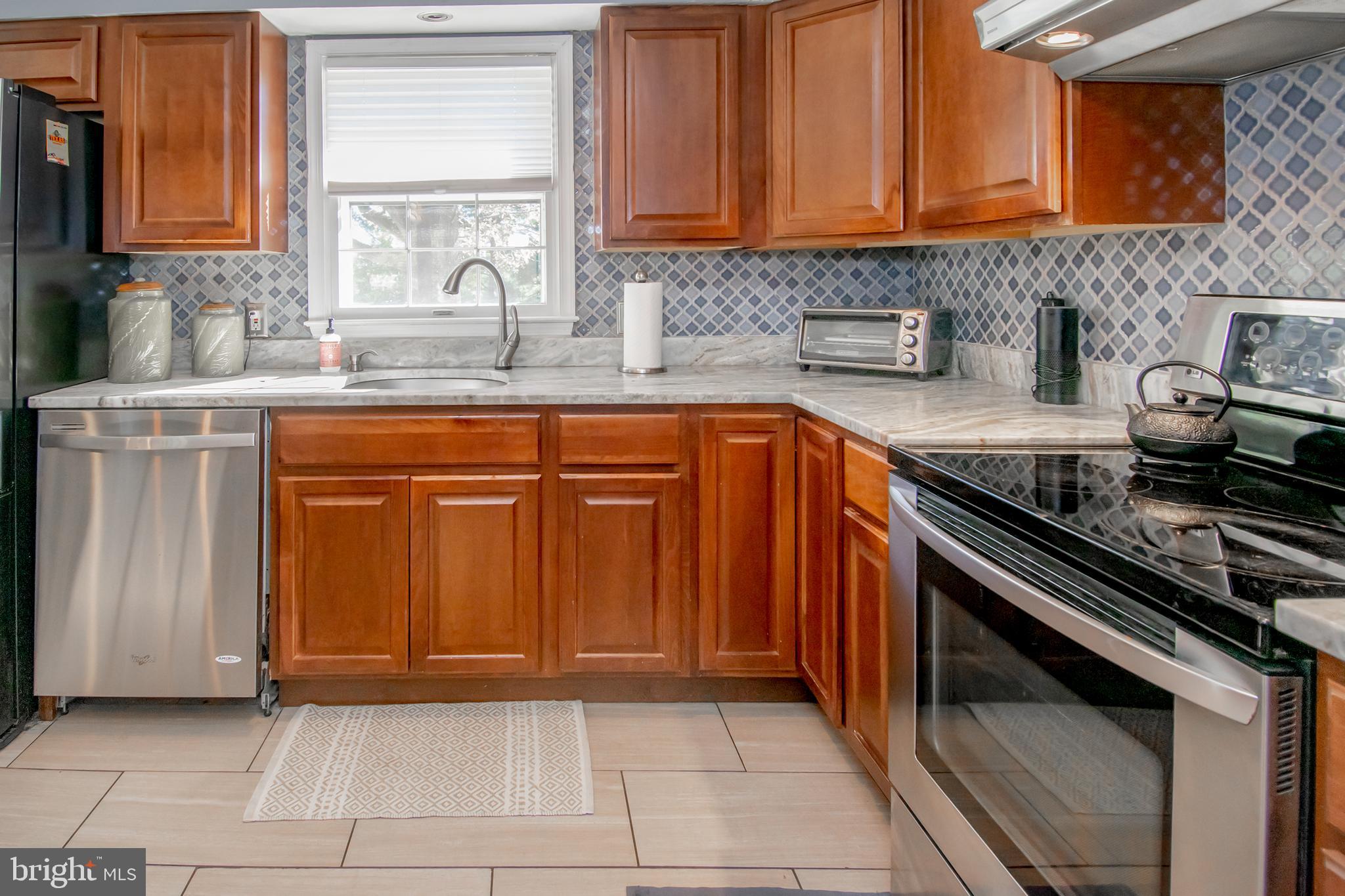 1015 Klees Mill Road Westminster, MD 21157 - Photo 9 of 27 Granite counters & tile backsplash