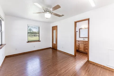 a view of an empty room with furniture