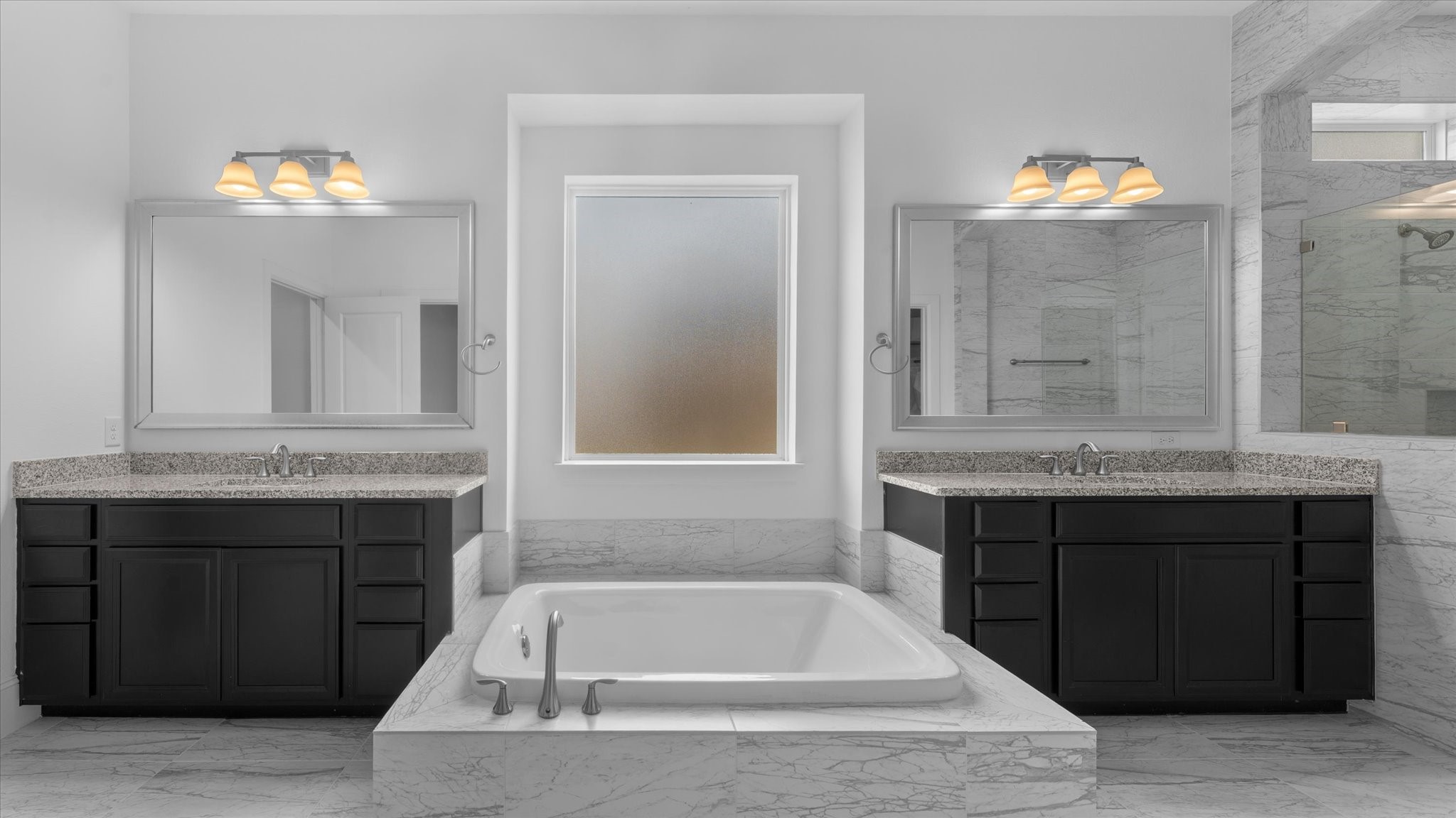 32001 Birch Briar Court Spring, TX 77386 - Photo 3 of 48 Spa-inspired primary bathroom featuring dual vanities, a soaking tub, oversized walk-in shower, and luxury finishes.