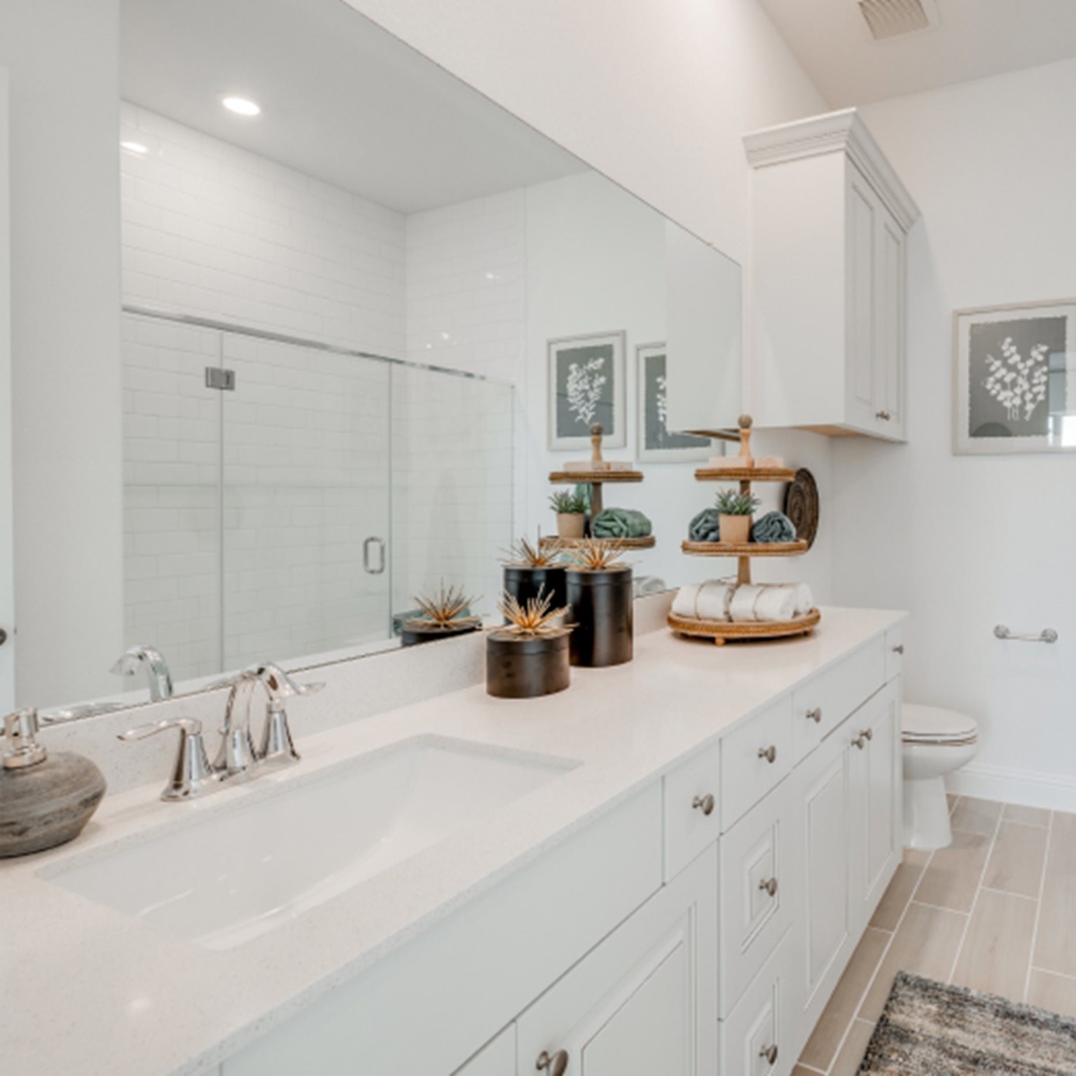 31535 Fern Grove Road Fulshear, TX 77423 - Photo 19 of 26 a kitchen with sink a stove and cabinets