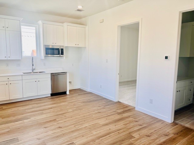 31535 Fern Grove Road Fulshear, TX 77423 - Photo 3 of 26 a view of kitchen with wooden floor and electronic appliances