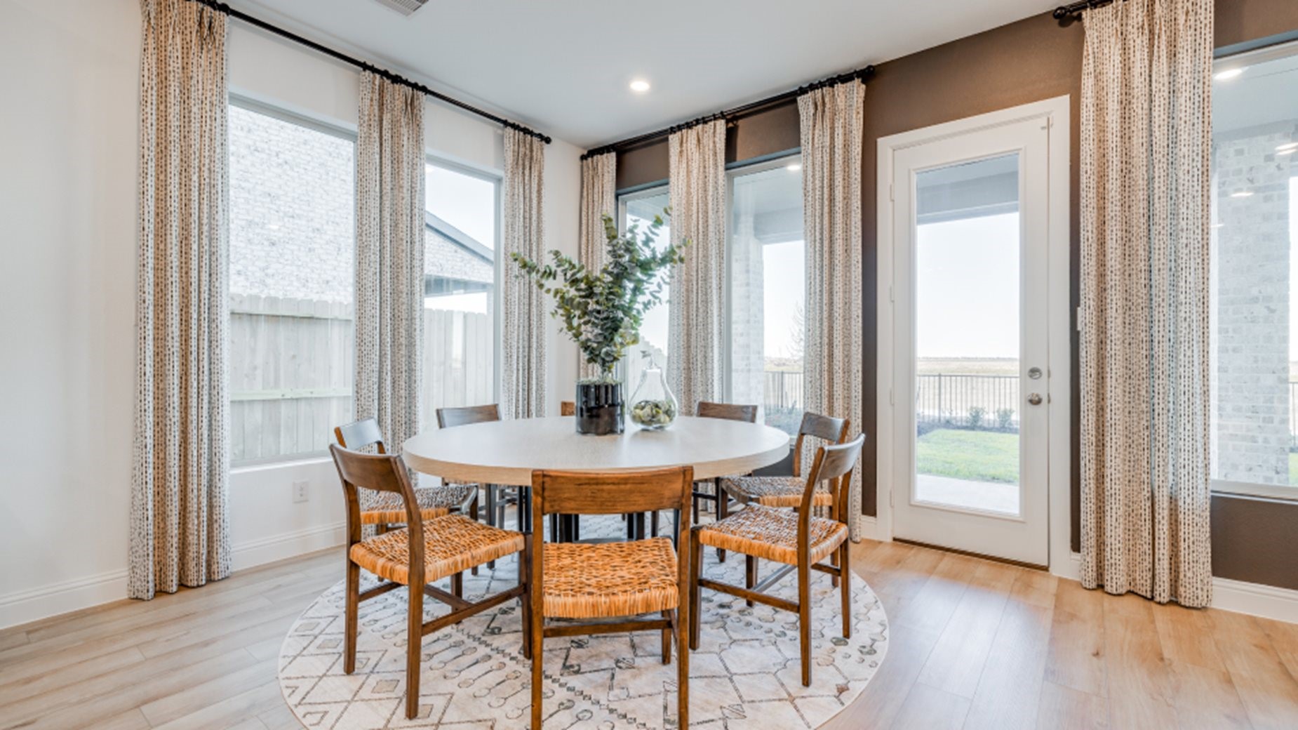 31535 Fern Grove Road Fulshear, TX 77423 - Photo 16 of 26 a view of a dining room with furniture and wooden floor