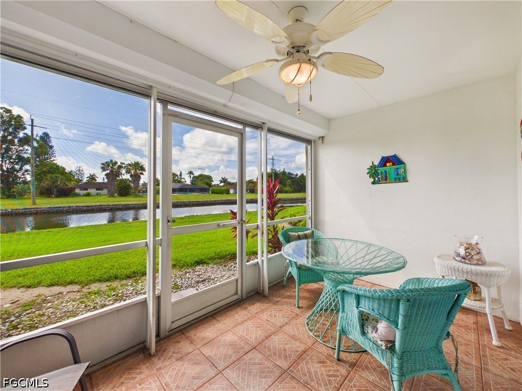 300 Valley Stream Drive, Unit 3D Naples, FL 34113 - Photo 19 of 21 a view of a porch with furniture and a garden