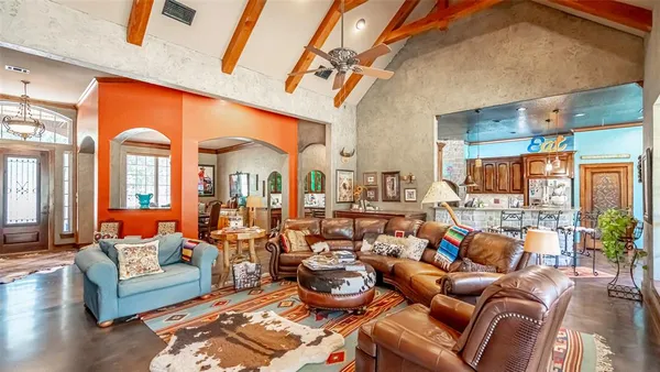 a living room with furniture and a large window