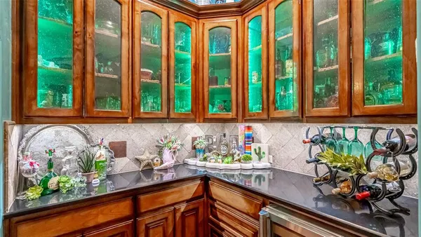 a kitchen with a large window and sink