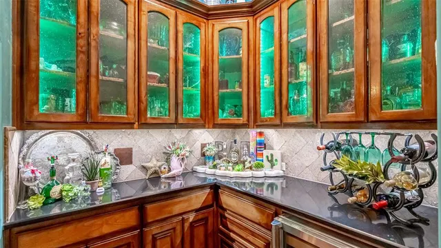 a kitchen with a large window and sink