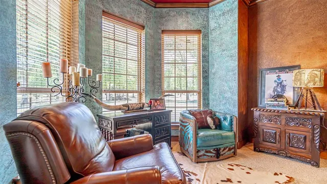 a bedroom with furniture and a window