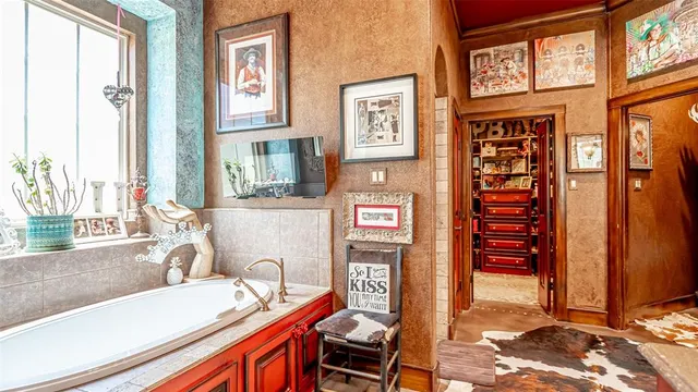 a bathroom view with a sink and a window