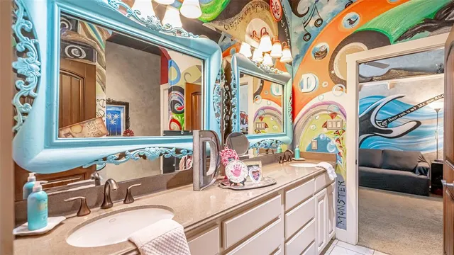 a bathroom with a sink a mirror and a bathtub