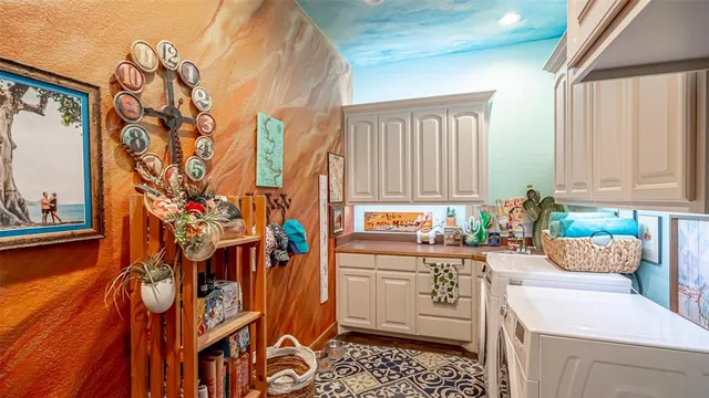 a kitchen with stainless steel appliances a sink and cabinets