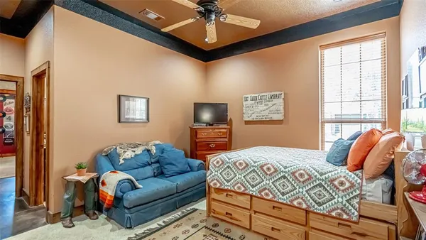 a bedroom with furniture and a window