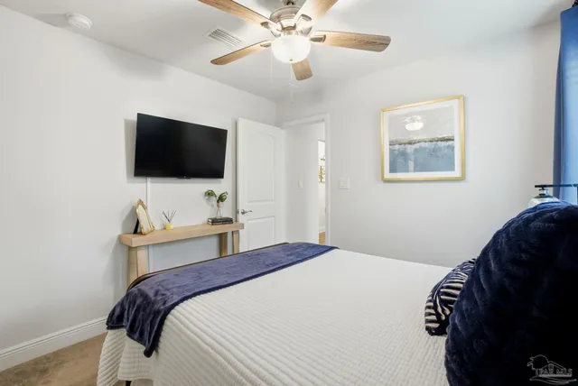 a bathroom with a granite countertop sink toilet a mirror and shower