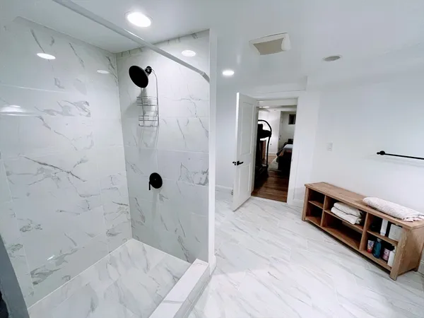 a bathroom with a sink and a shower