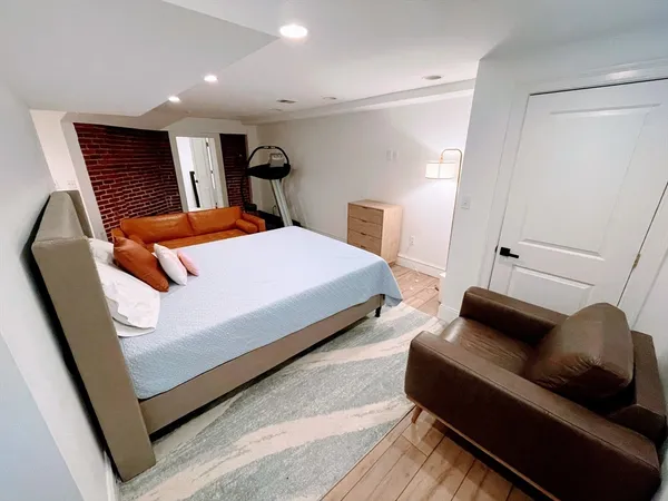 a bedroom with bed and window
