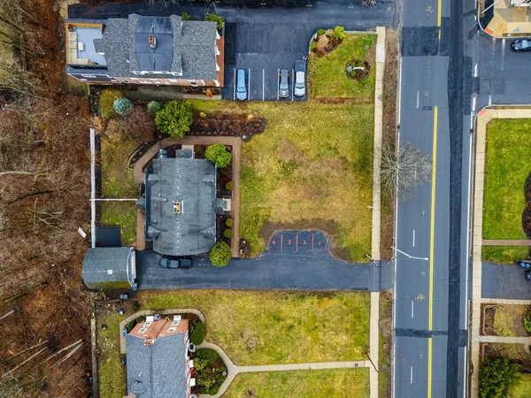 an aerial view of a house with a swimming pool