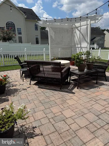 a view of a terrace with sitting area
