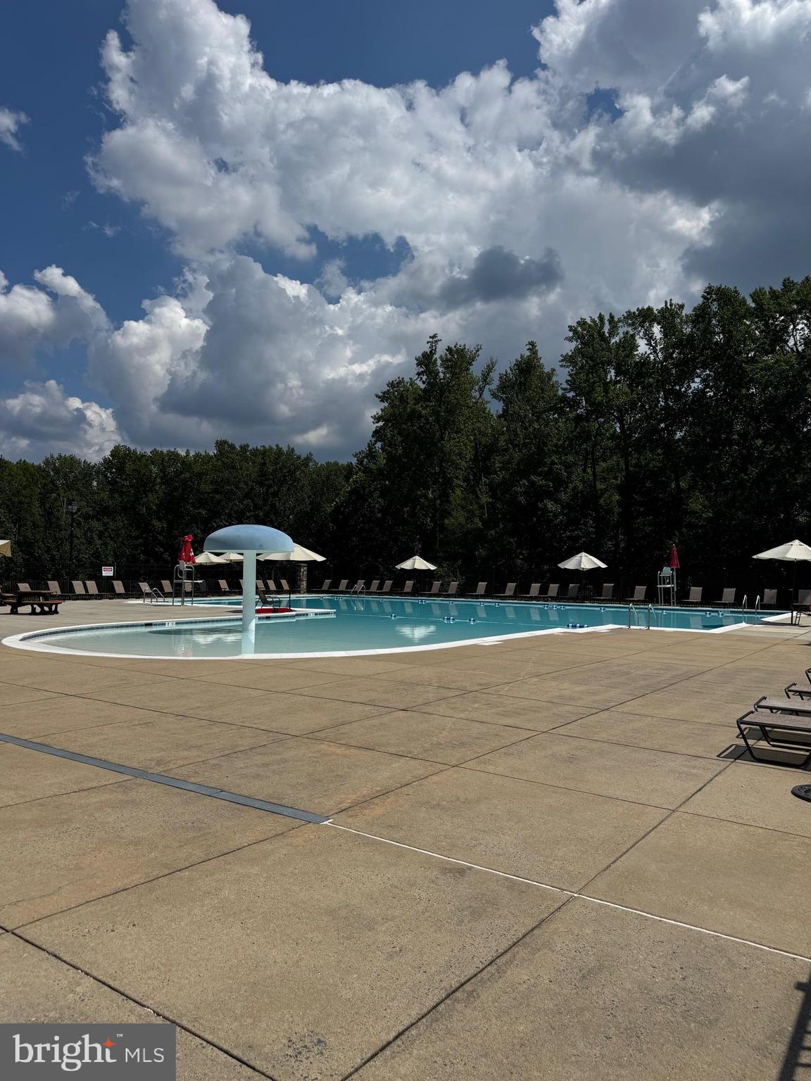 7147 Wedmore Court Hanover, MD 21076 - Photo 9 of 11 a view of a yard with cars parked