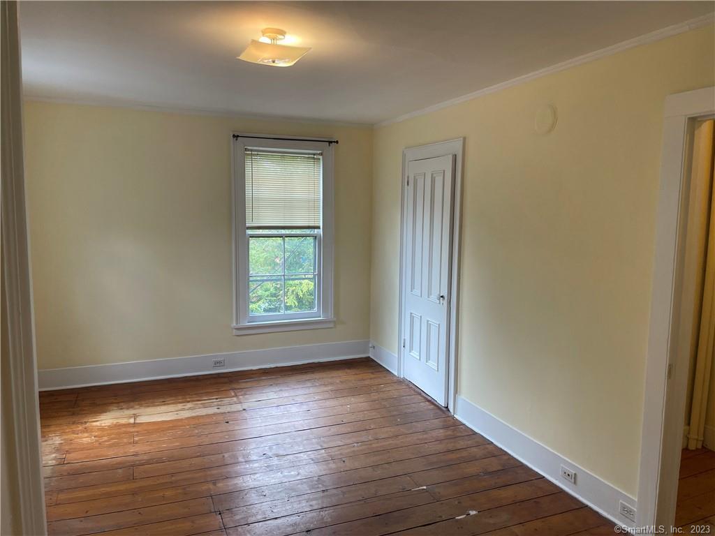 33 West Main Street, Unit 3 Sharon, CT 06069 - Photo 13 of 20 Spacious bedroom-large closet all with wide wooden floorboards
