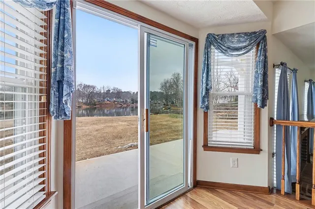 a view of kitchen with closet and wooden floor