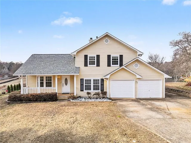 a front view of a house with a yard