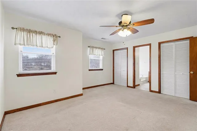 a bathroom with a bathtub a sink and a window