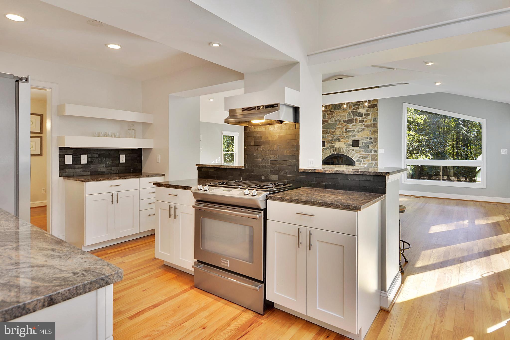 2615 Cool Spring Road Adelphi, MD 20783 - Photo 8 of 30 a kitchen with stainless steel appliances granite countertop a stove a sink and a microwave