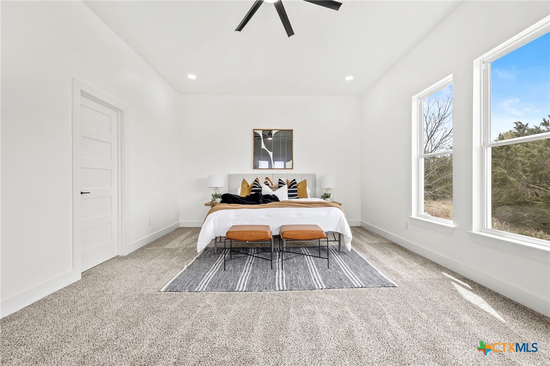 108 Skyline Road Georgetown, TX 78628 - Photo 20 of 48 a bedroom with a bed and a window