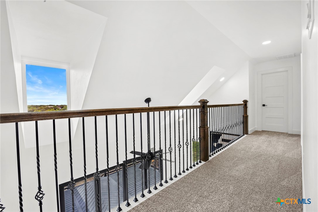 108 Skyline Road Georgetown, TX 78628 - Photo 24 of 48 a view of a hallway with wooden floor