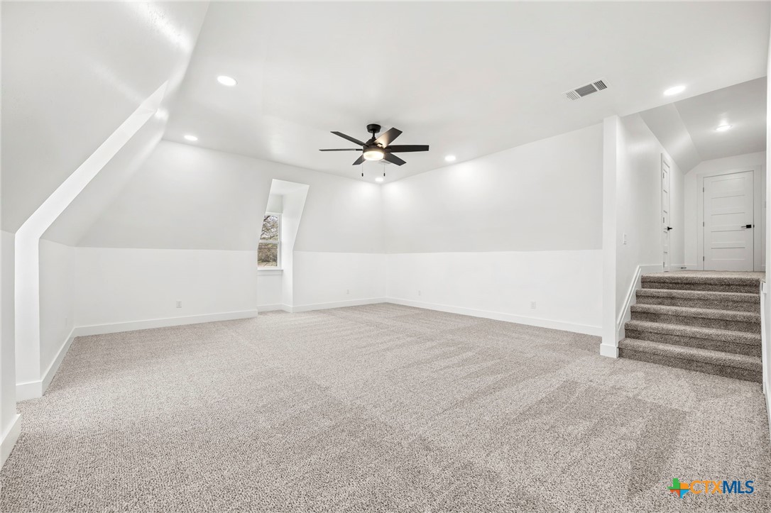 108 Skyline Road Georgetown, TX 78628 - Photo 26 of 48 an empty room with a ceiling fan and a window