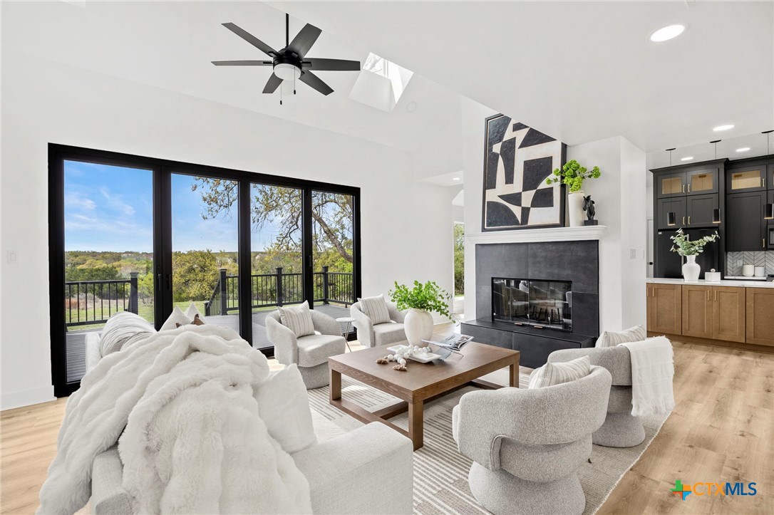 108 Skyline Road Georgetown, TX 78628 - Photo 3 of 48 a living room with furniture large window and a fireplace