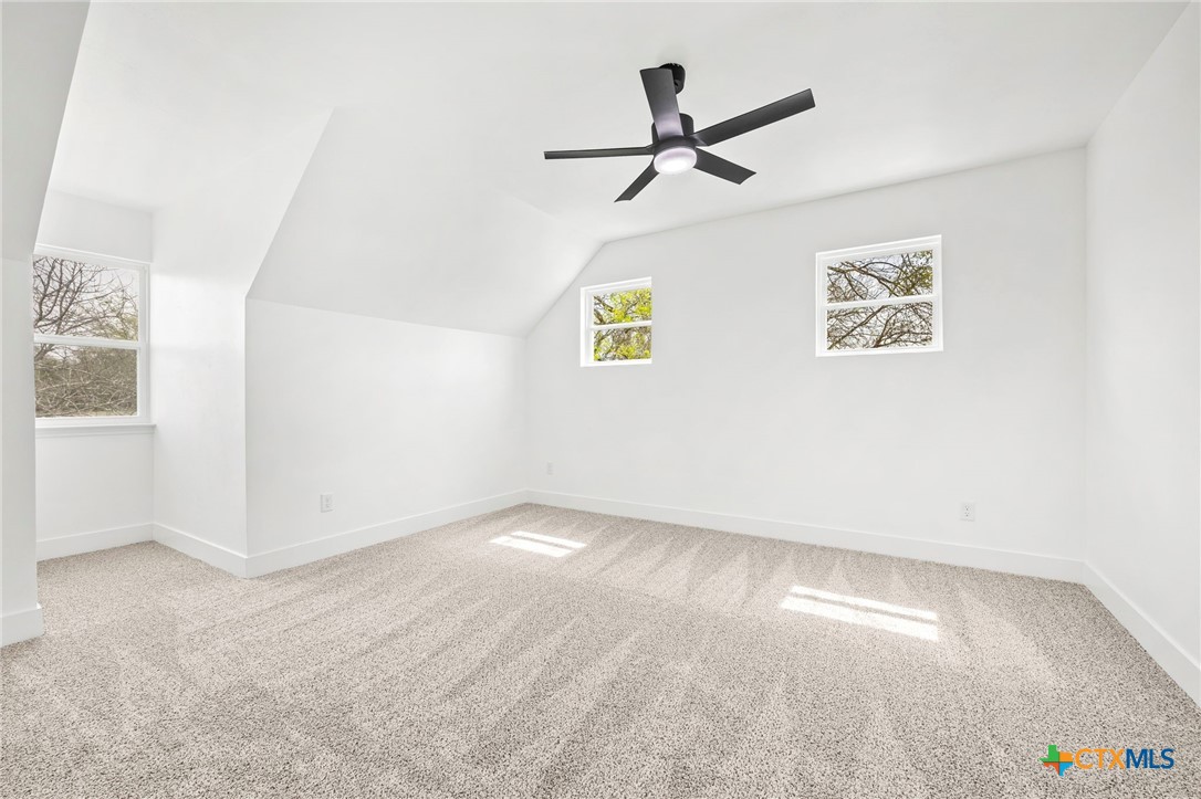 108 Skyline Road Georgetown, TX 78628 - Photo 34 of 48 an empty room with windows and fan