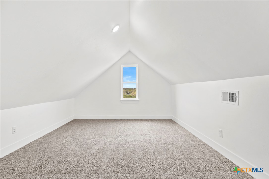 108 Skyline Road Georgetown, TX 78628 - Photo 38 of 48 an empty room with a empty space and windows