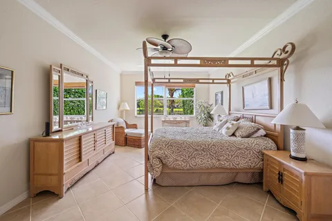 a spacious bathroom with a granite countertop tub sink shower and mirror
