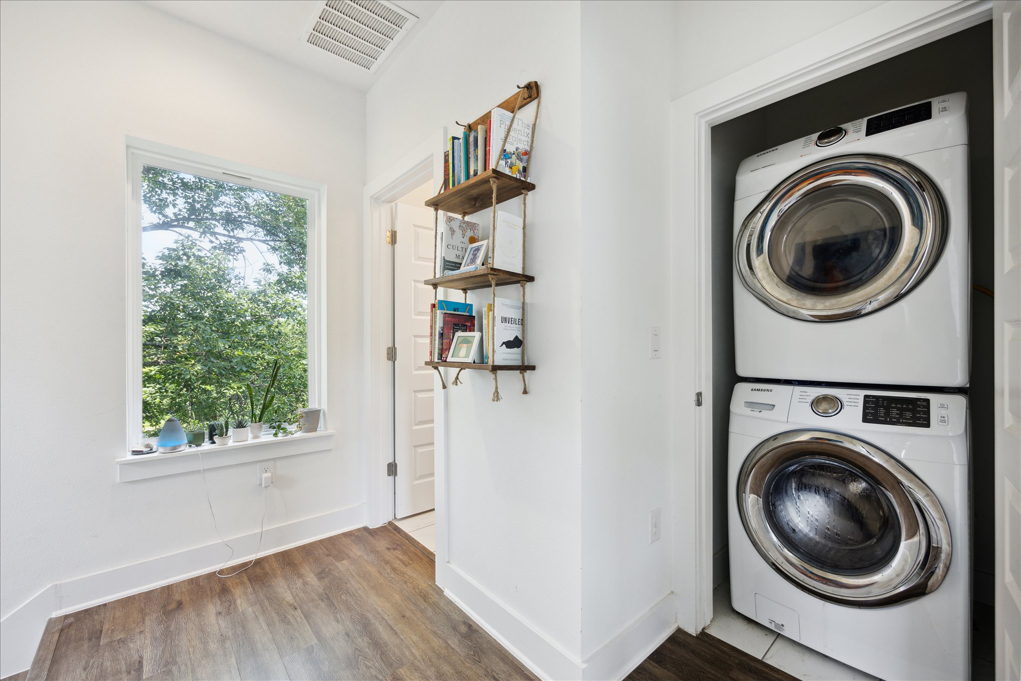5006 Baker Street, Unit B Austin, TX 78721 - Photo 11 of 16 a view of a hallway with washer and dryer
