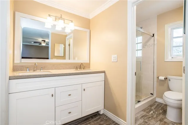 a bathroom with a toilet sink and shower