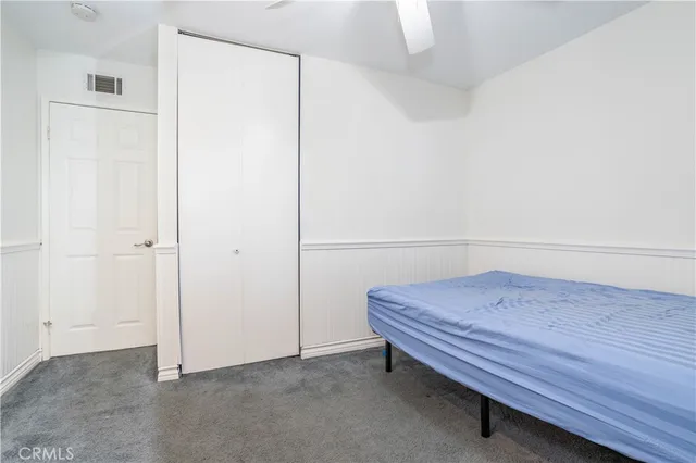 an aerial view of a house with a yard and garden