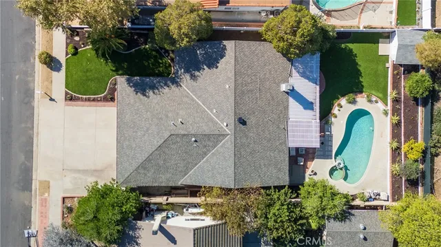 an aerial view of houses with outdoor space