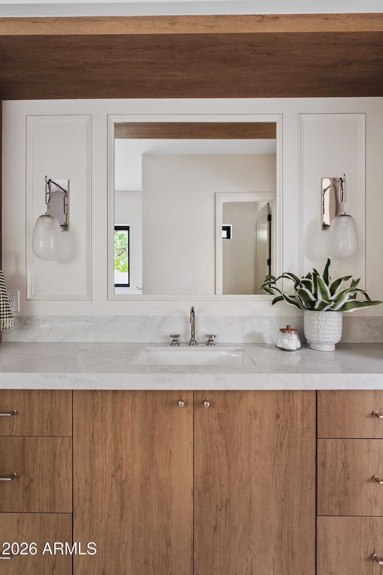 4035 East Osborn Road Phoenix, AZ 85018 - Photo 24 of 63 a bathroom with a sink and a mirror