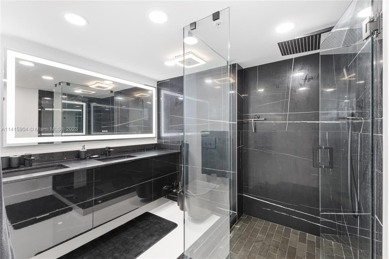 Miami Beach Miami Beach, FL 33139 - Photo 20 of 41 a bathroom with a shower and a sink