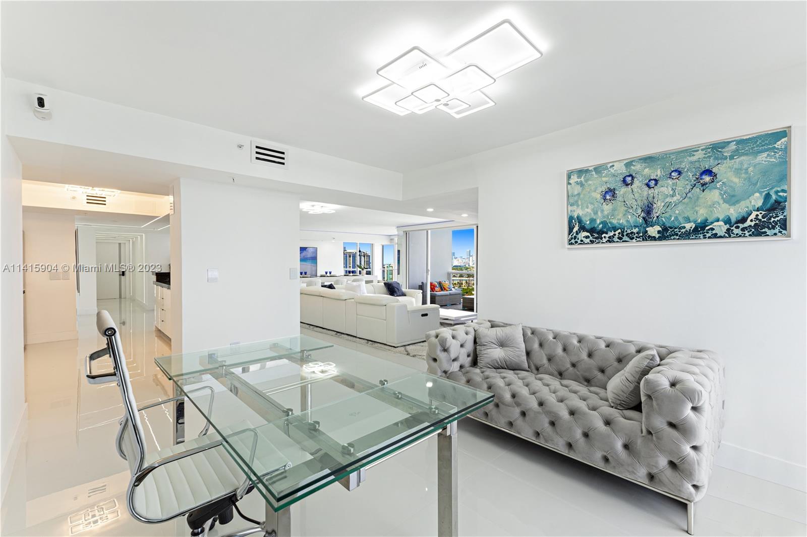 Miami Beach Miami Beach, FL 33139 - Photo 23 of 41 a living room with furniture and a chandelier