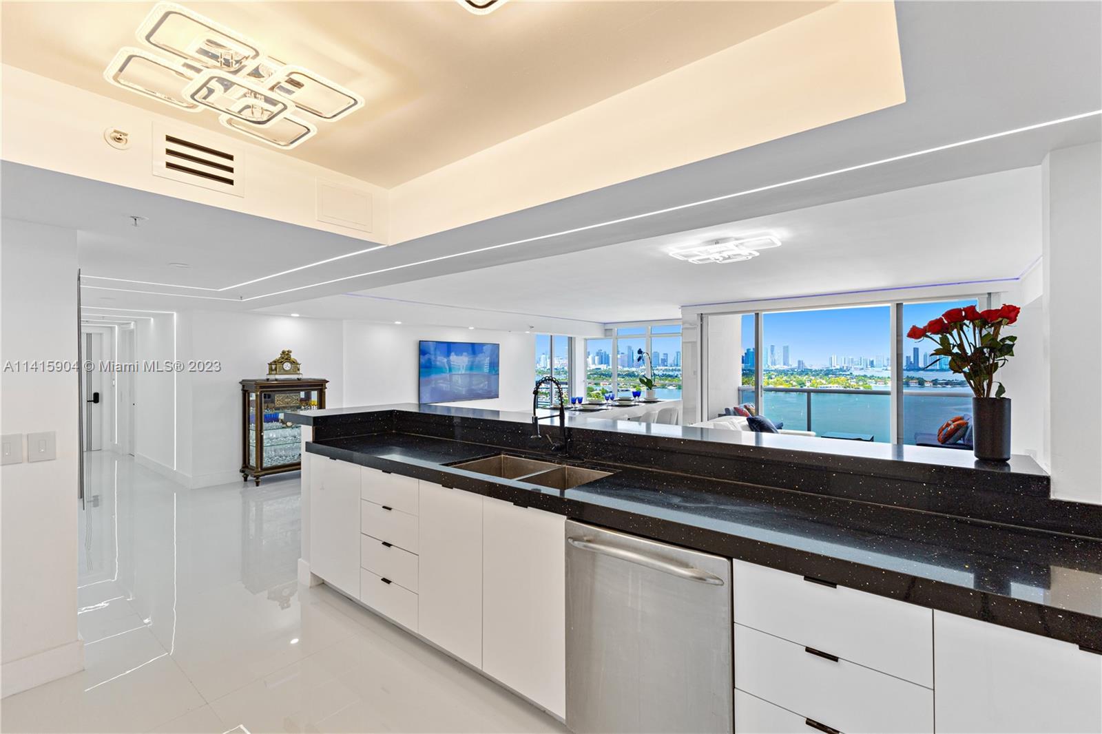 Miami Beach Miami Beach, FL 33139 - Photo 28 of 41 a kitchen with granite countertop a sink and cabinets