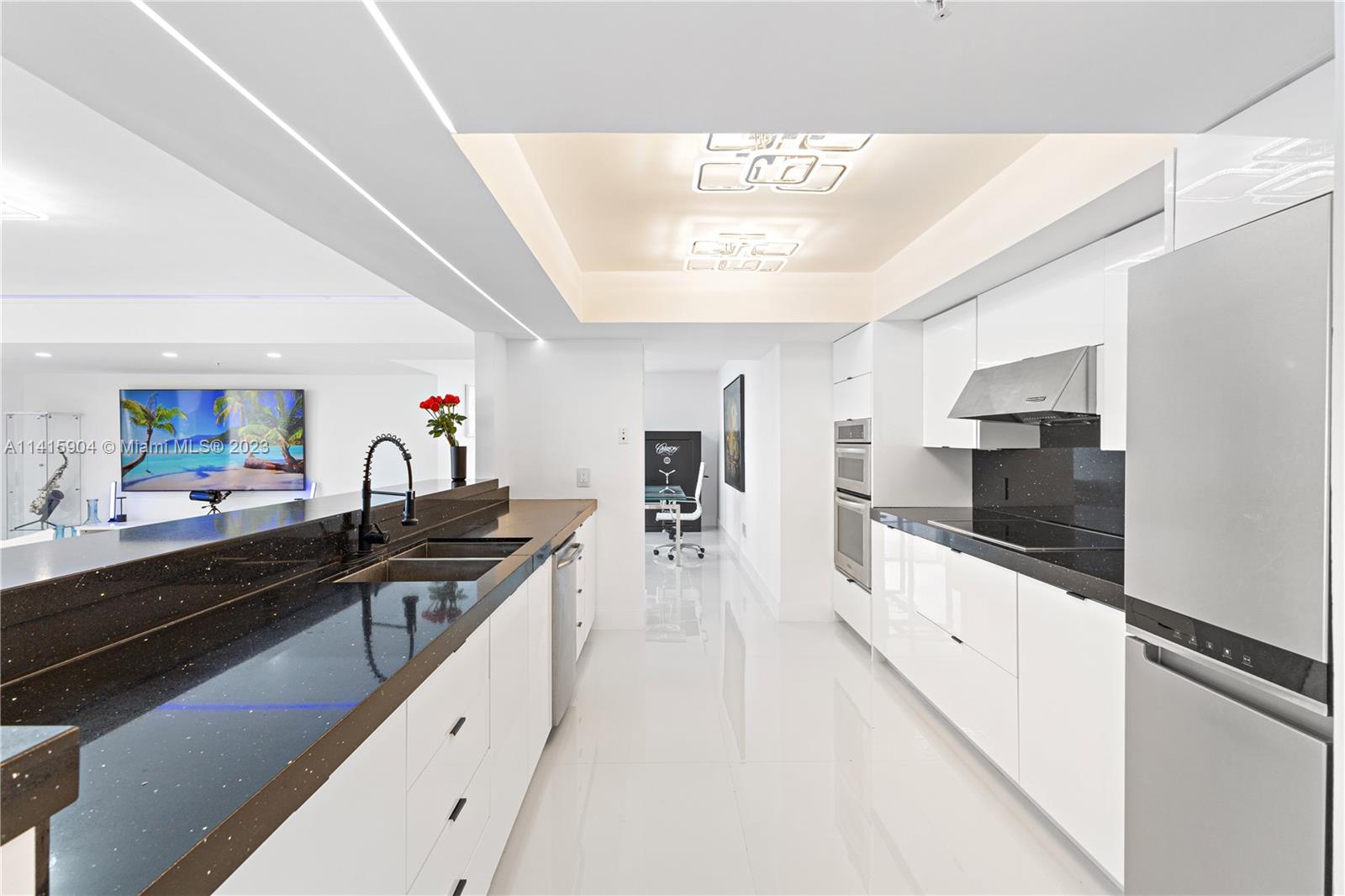 Miami Beach Miami Beach, FL 33139 - Photo 29 of 41 a kitchen with stainless steel appliances a sink stove and cabinets