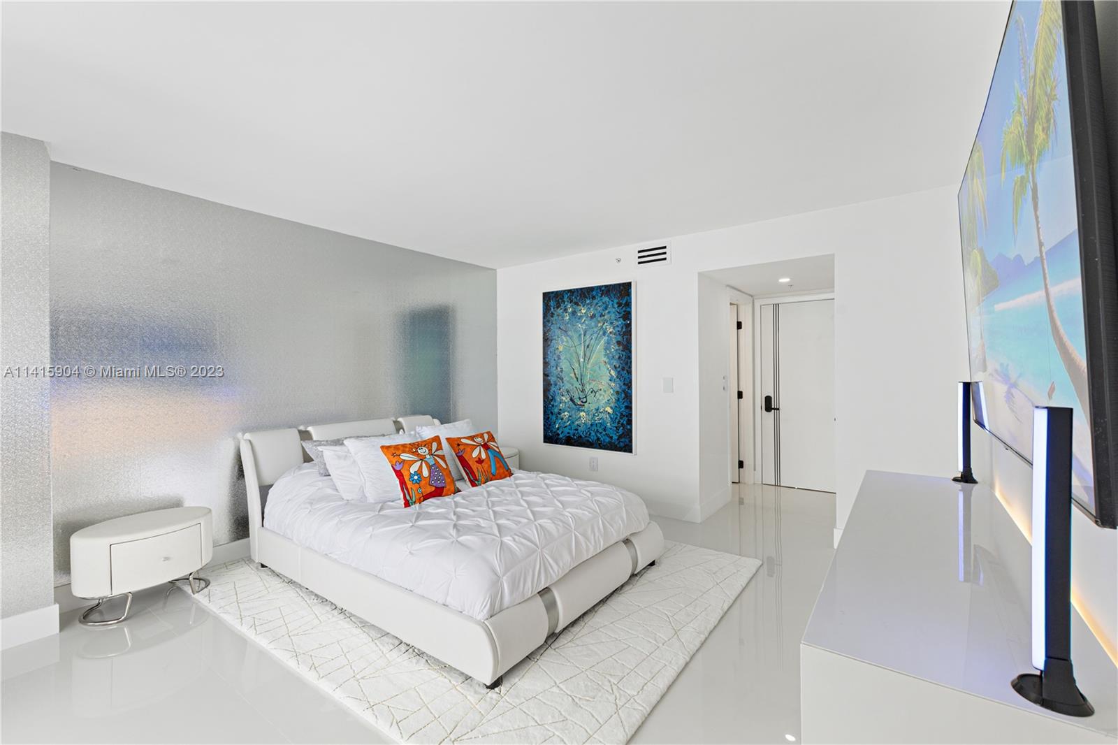 Miami Beach Miami Beach, FL 33139 - Photo 33 of 41 a bedroom with a bed and a couch