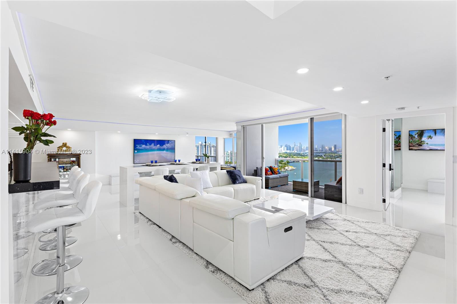 Miami Beach Miami Beach, FL 33139 - Photo 4 of 41 a living room with furniture a potted plant and white walls