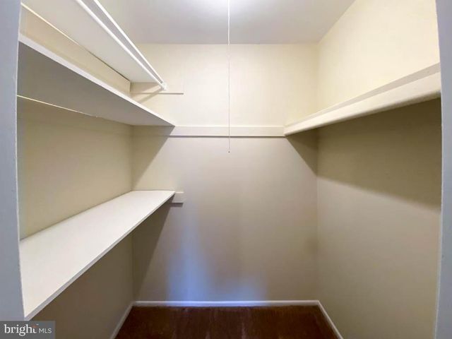 a bedroom with a bed and a mirror