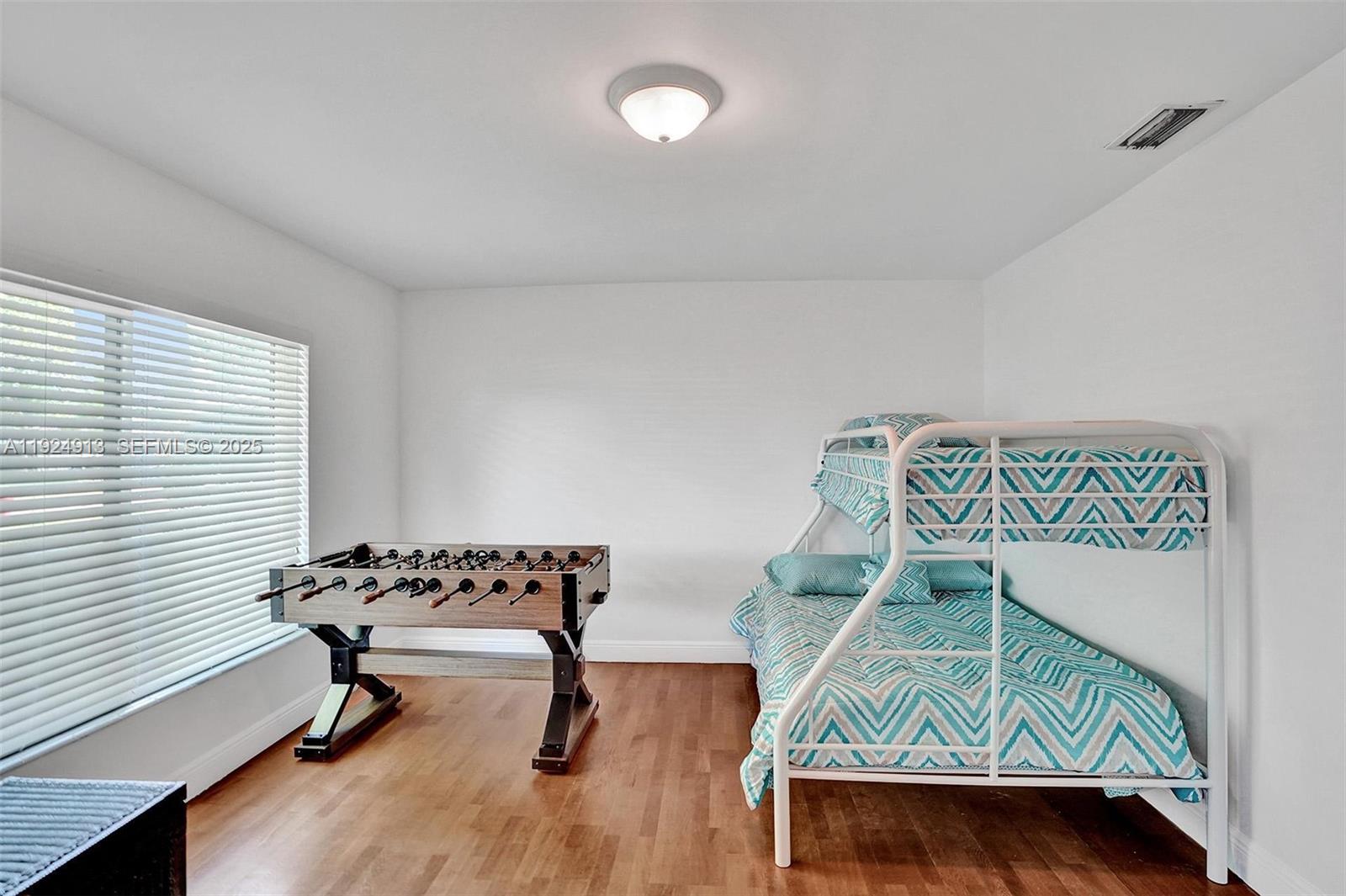2620 Northeast 19th Street Pompano Beach, FL 33062 - Photo 15 of 42 a living room with furniture and a window