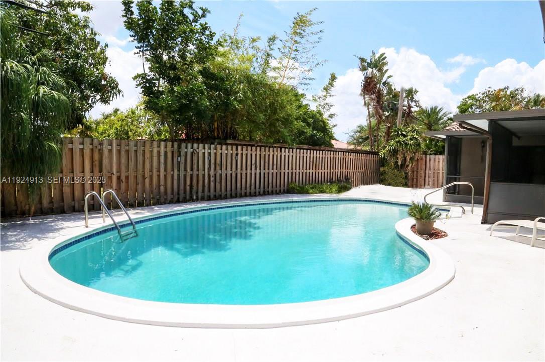 2620 Northeast 19th Street Pompano Beach, FL 33062 - Photo 2 of 42 a view of a swimming pool with a patio