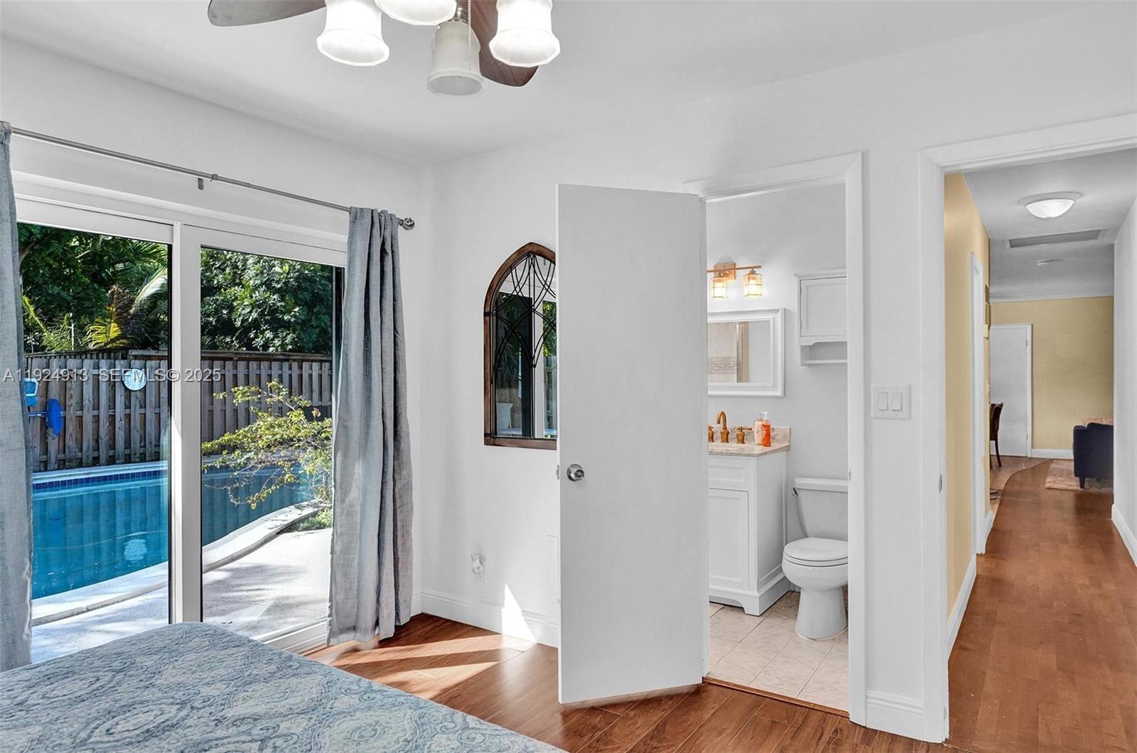 2620 Northeast 19th Street Pompano Beach, FL 33062 - Photo 21 of 42 a view of an entryway with wooden floor and windows