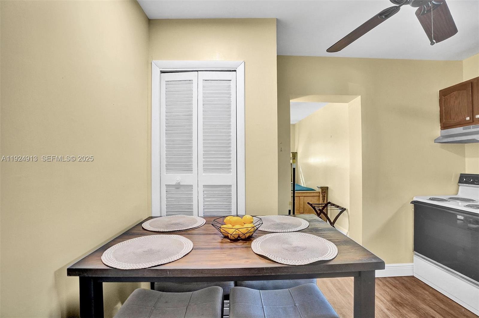 2620 Northeast 19th Street Pompano Beach, FL 33062 - Photo 25 of 42 a view of a dining room with furniture and wooden floor